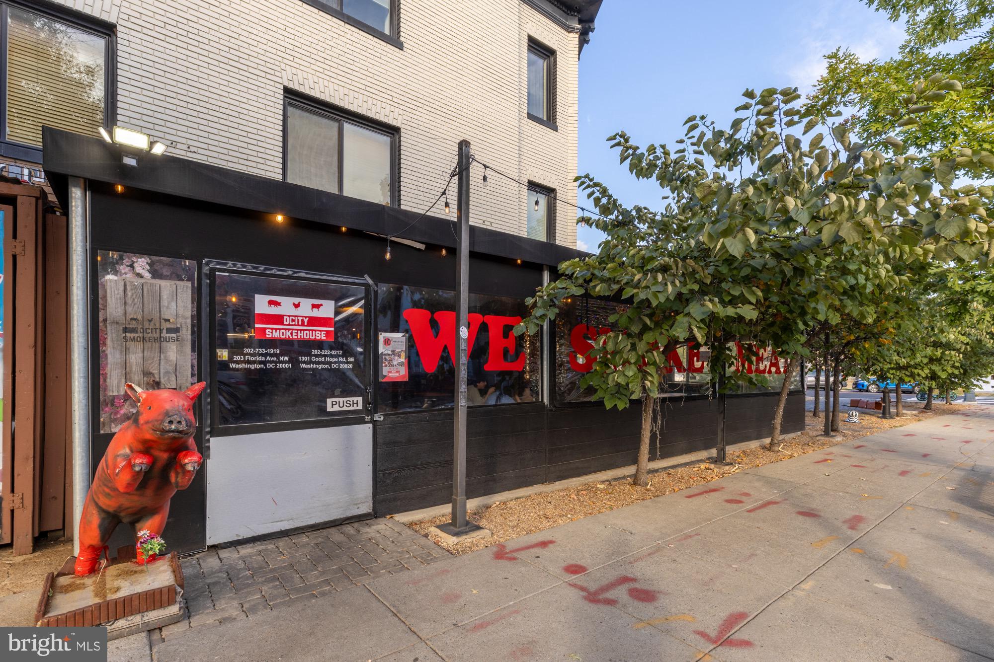 54 W Street Northwest Washington, DC 20001 - Photo 61 of 68 Vibrant eatery with playful pig statue.
