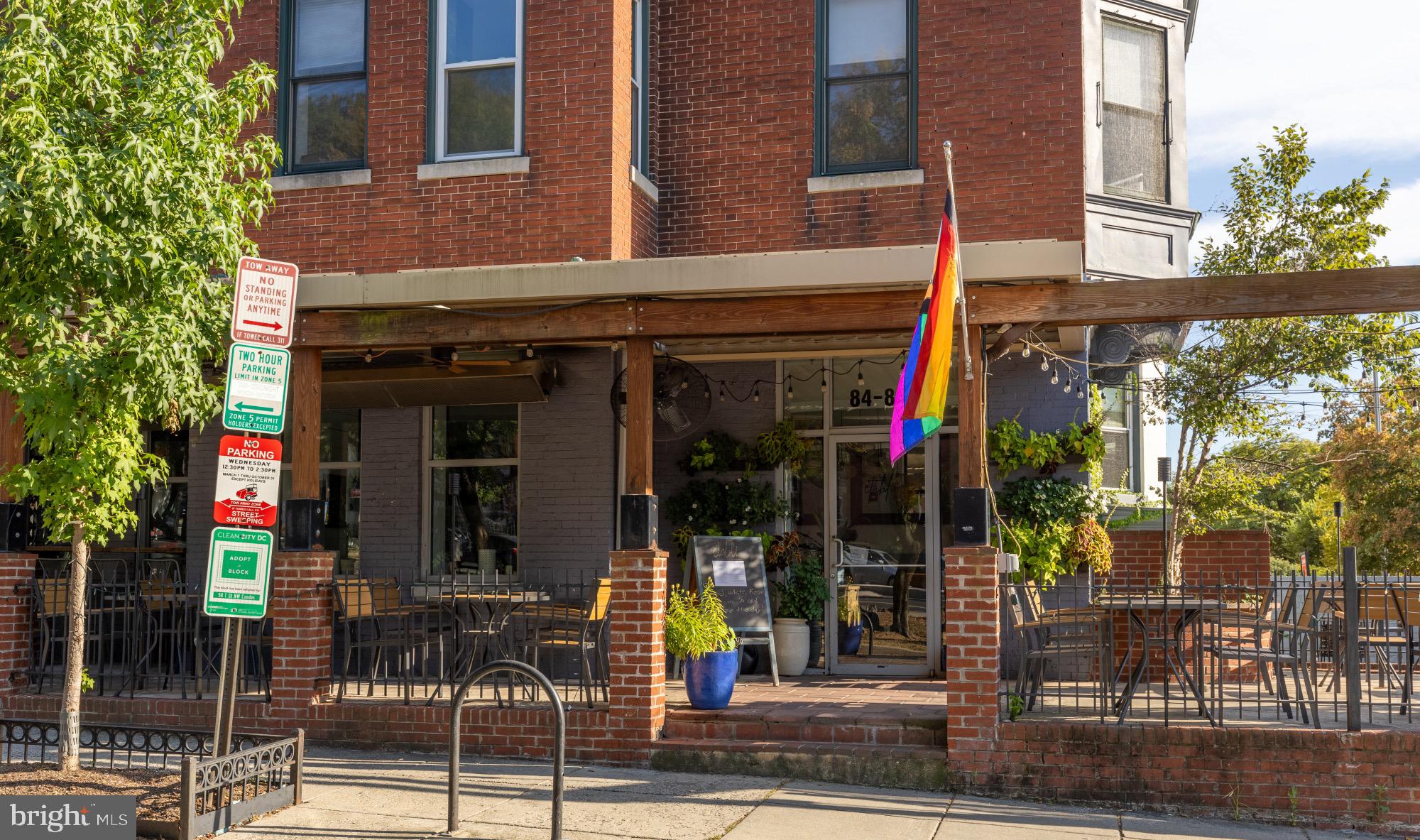 54 W Street Northwest Washington, DC 20001 - Photo 63 of 68 Charming cafe with vibrant pride flag.