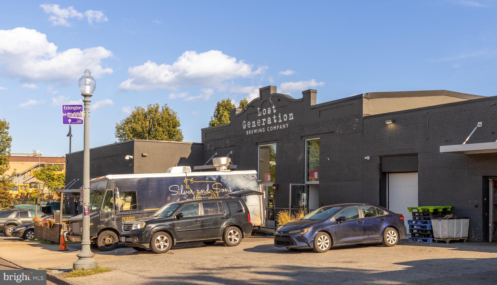 54 W Street Northwest Washington, DC 20001 - Photo 66 of 68 Vibrant brewery scene with food truck charm.