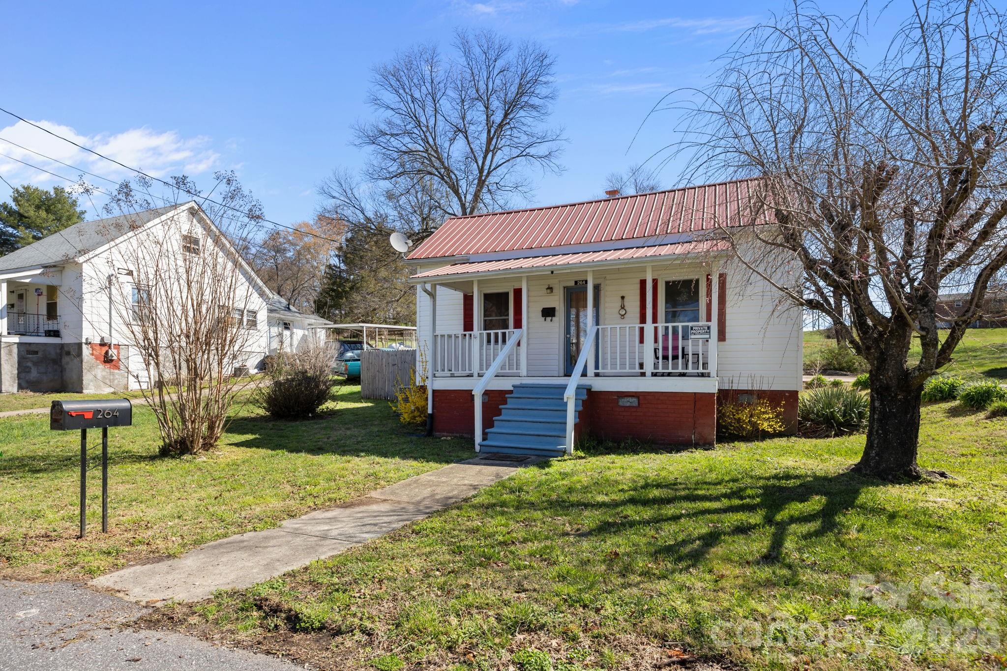 264 Church Street Marion, NC 28752 - Photo 1 of 20 a view of house with a yard