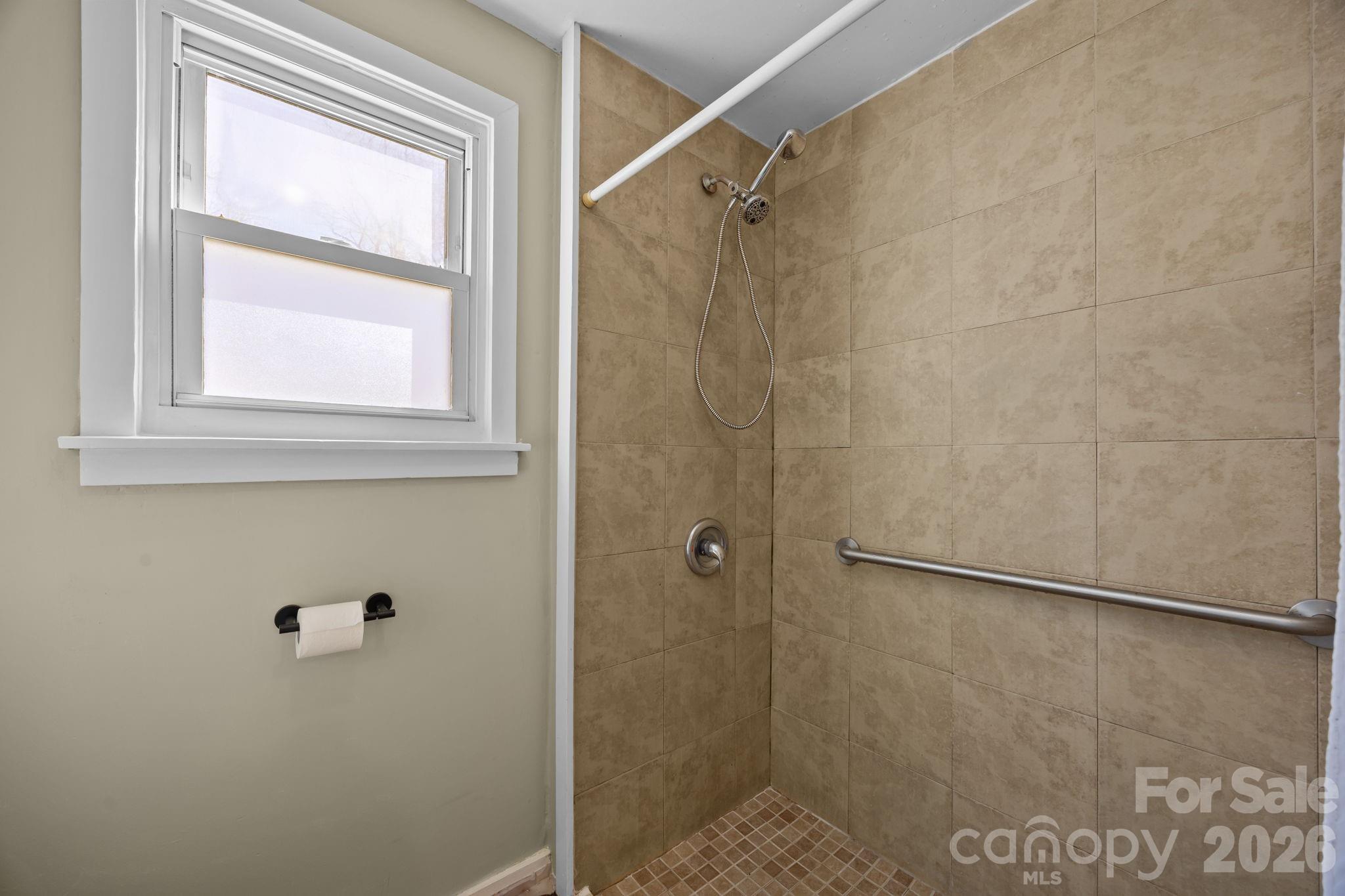 264 Church Street Marion, NC 28752 - Photo 13 of 20 a bathroom with a shower