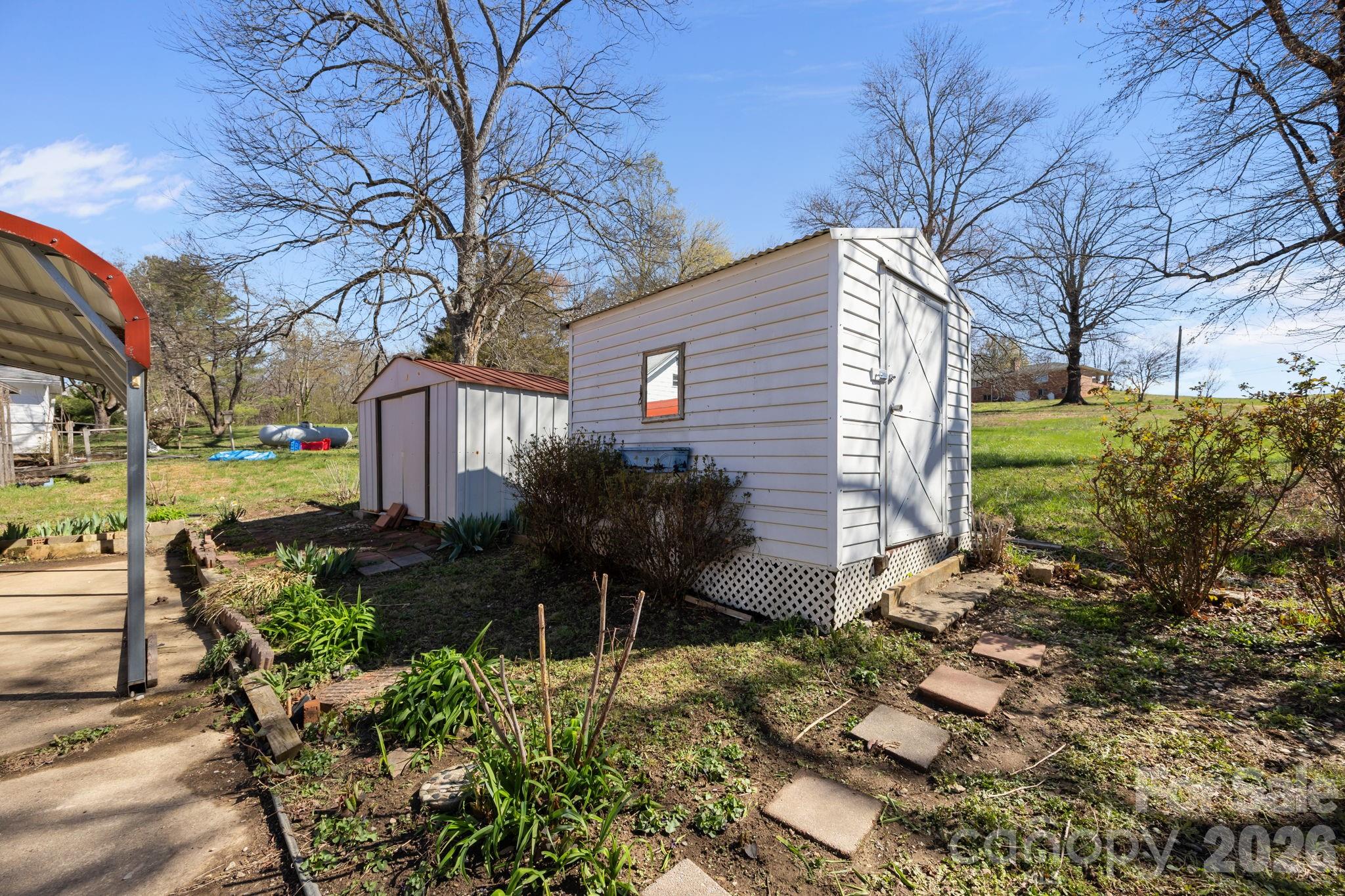 264 Church Street Marion, NC 28752 - Photo 19 of 20 a front view of a house with garden