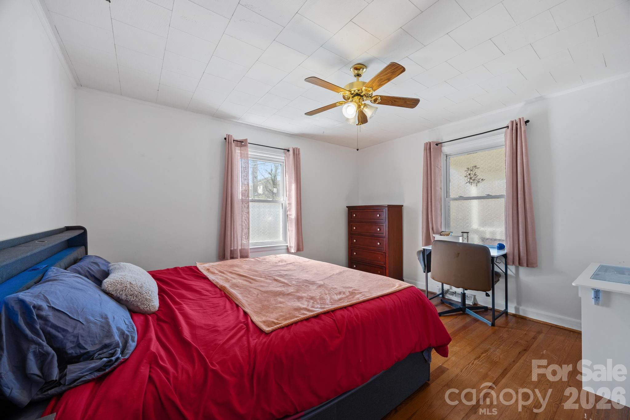264 Church Street Marion, NC 28752 - Photo 10 of 20 a bedroom with a bed and a window