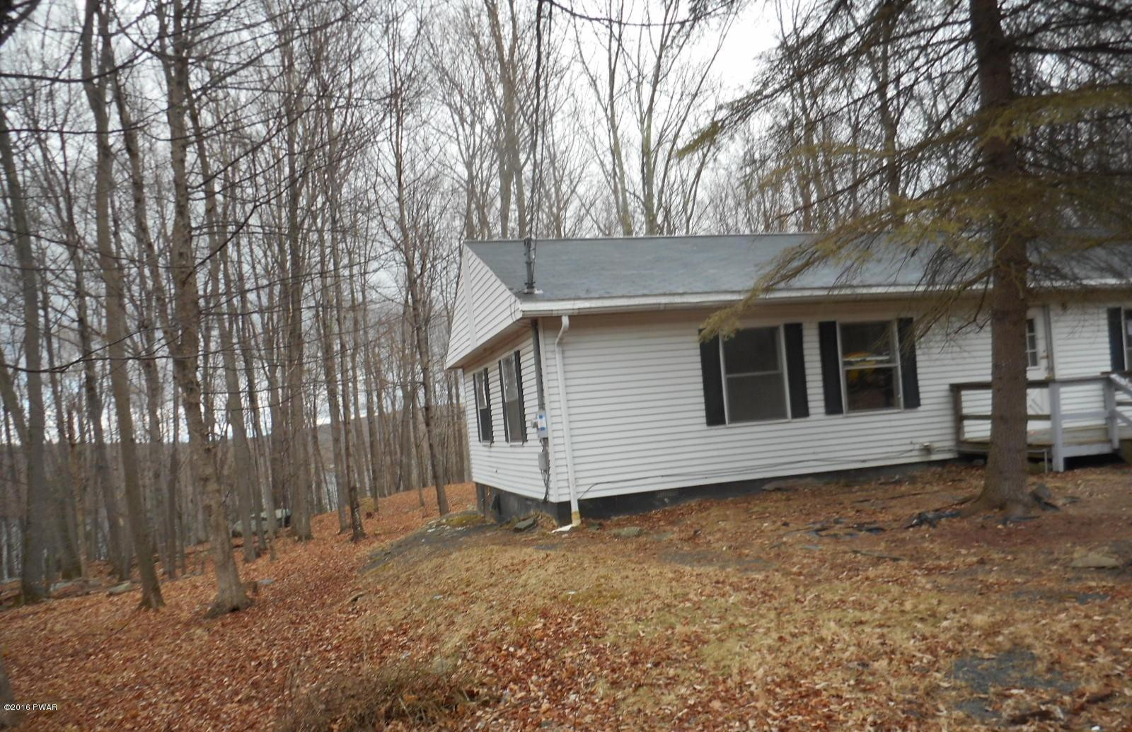 544 Hummingbird Lane Hawley, PA 18428 - Photo 2 of 16 a view of a house with a yard