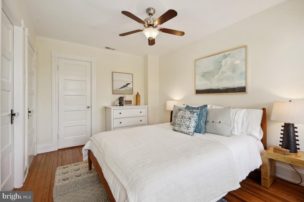 514 15th Street Southeast Washington, DC 20003 - Photo 18 of 36 a bedroom with a bed and a painting on the wall