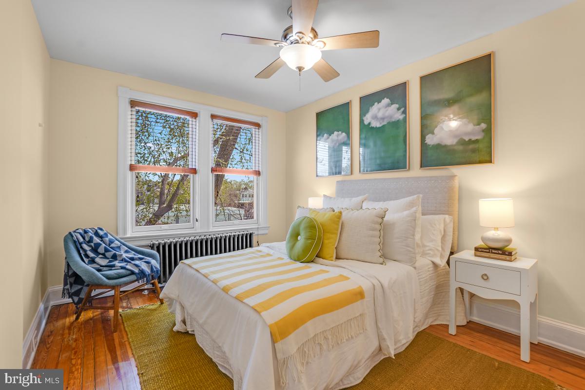 514 15th Street Southeast Washington, DC 20003 - Photo 21 of 36 a bedroom with a bed and wooden floor