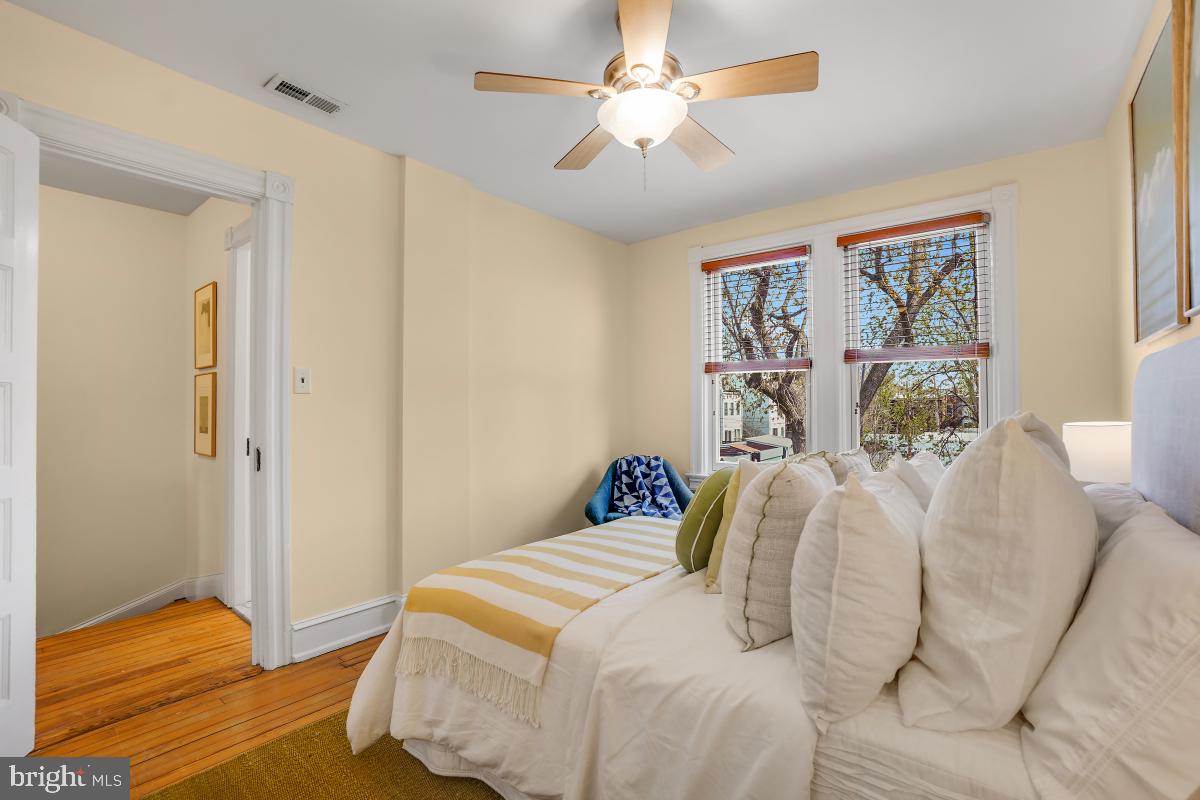 514 15th Street Southeast Washington, DC 20003 - Photo 22 of 36 a bedroom with a bed and wooden floor