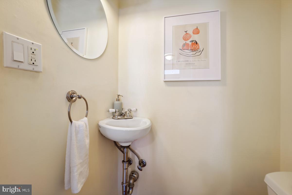 514 15th Street Southeast Washington, DC 20003 - Photo 27 of 36 a bathroom with a sink mirror and toilet