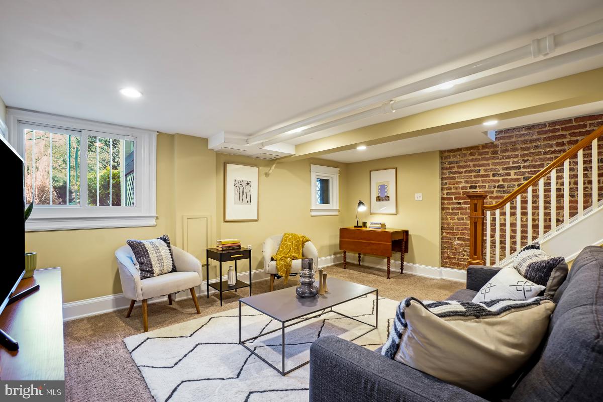 514 15th Street Southeast Washington, DC 20003 - Photo 30 of 36 a living room with furniture and a large window