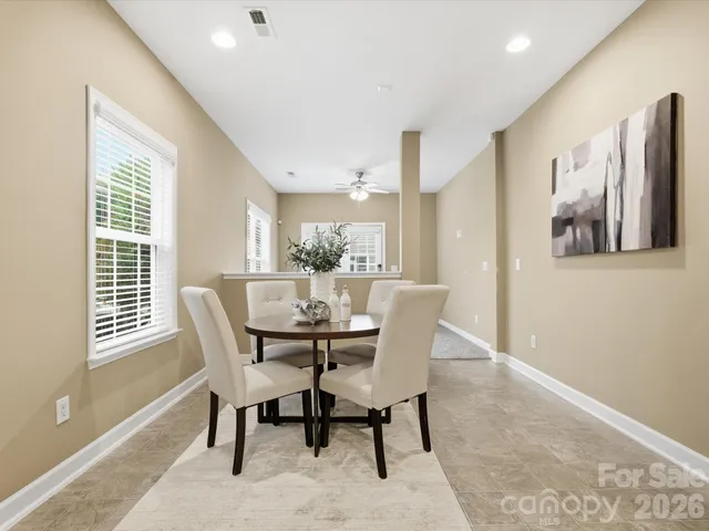 a view of a dining room with furniture and window