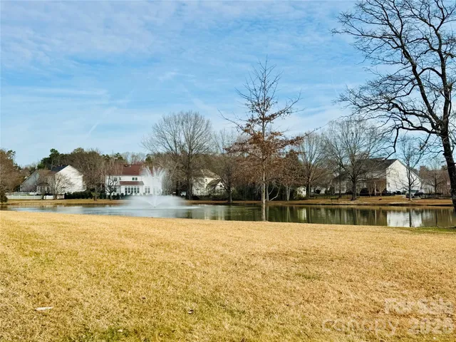 a swimming pool is sitting in the middle of a lake