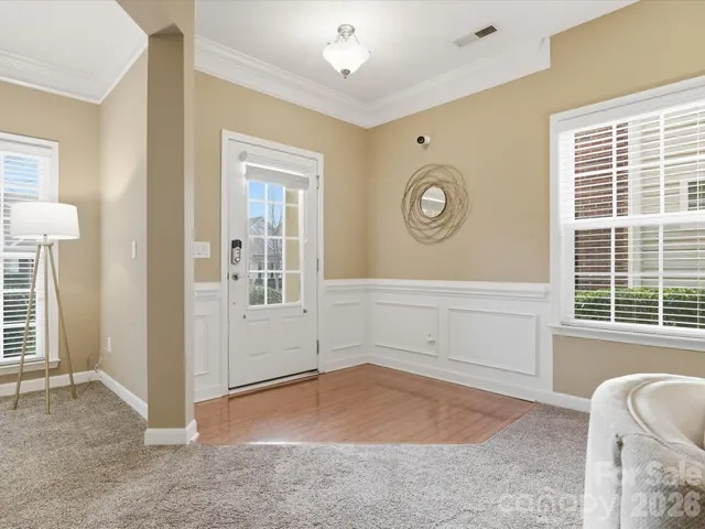 a view of a livingroom with furniture and windows