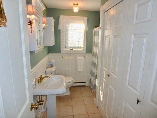 54 Schoolhouse Road Edgartown, MA 02539 - Photo 12 of 30 a bathroom with a sink a toilet and shower