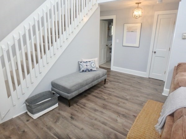54 Schoolhouse Road Edgartown, MA 02539 - Photo 2 of 30 a living room with furniture and a stairs