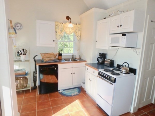 54 Schoolhouse Road Edgartown, MA 02539 - Photo 22 of 30 a room with storage and utility