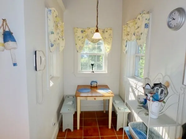 a bathroom with a sink mirror and window