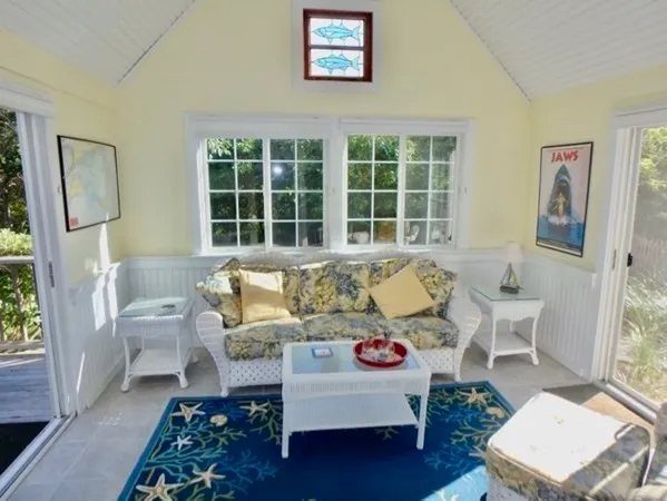 a living room with furniture and a window