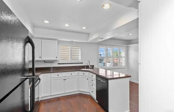 a kitchen with a sink stove and refrigerator