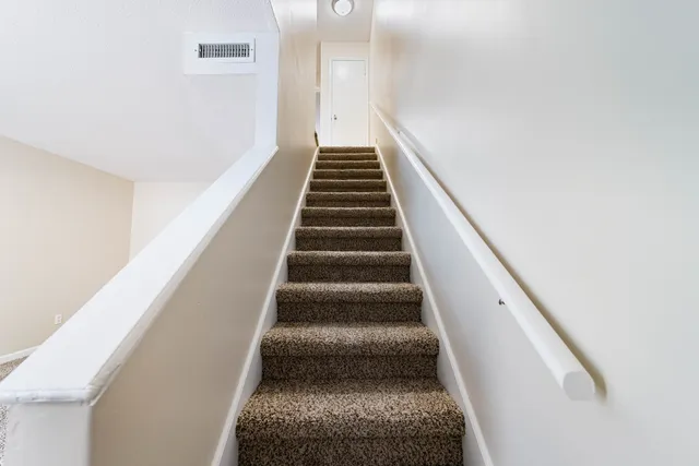 a view of a room with a hallway