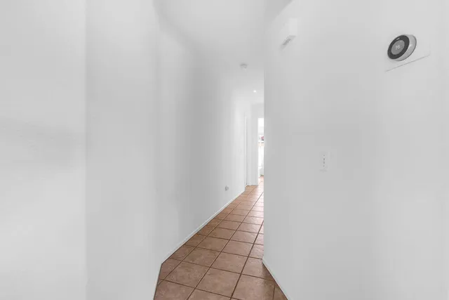 a bedroom with a bed and a table in it