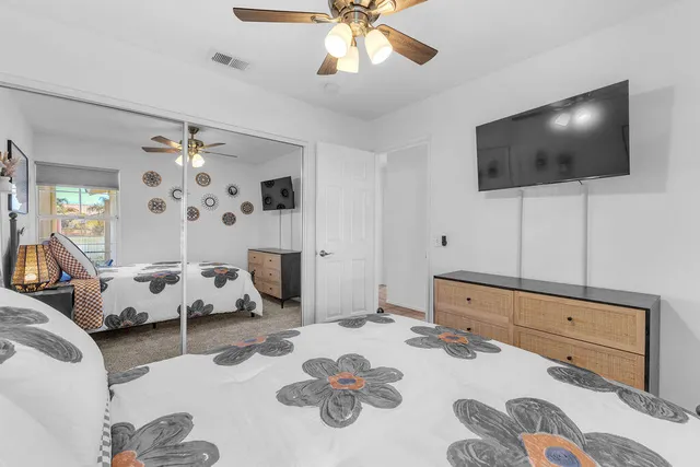 a bedroom with bed and a window