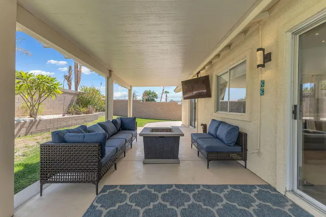 a view of a backyard with a garden and plants