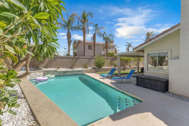 a view of a house with swimming pool