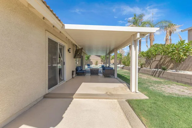 a view of a backyard with a garden and plants