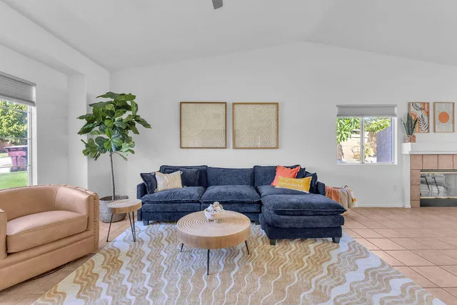 a living room with furniture and a couch