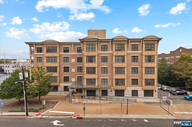 a front view of a building with street view