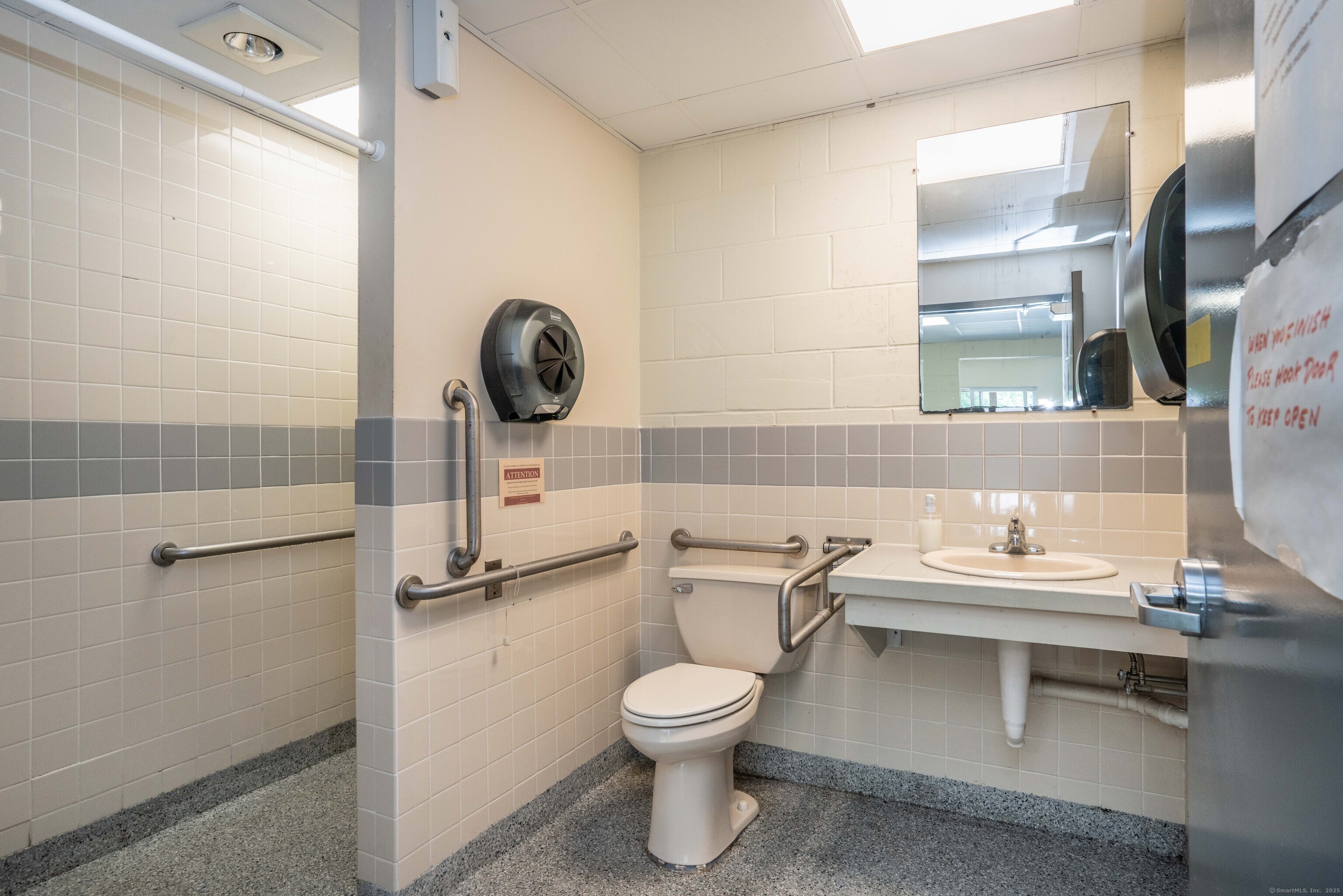 262 Shetucket Turnpike, Unit 2 Griswold, CT 06351 - Photo 5 of 26 a bathroom with a toilet a sink and a mirror
