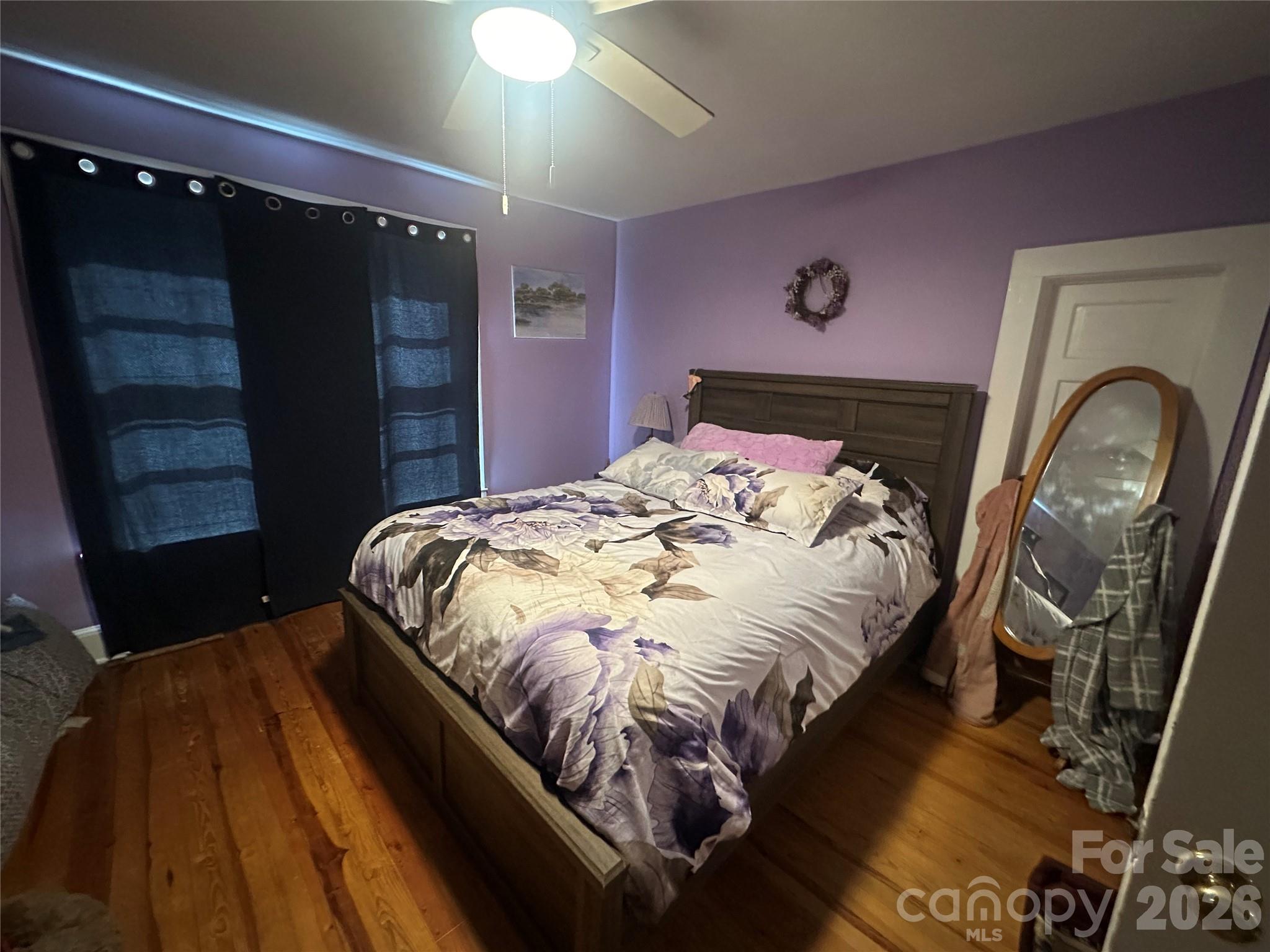 241 Wilson Road Rutherfordton, NC 28139 - Photo 9 of 14 a bed sitting in a bedroom next to a window