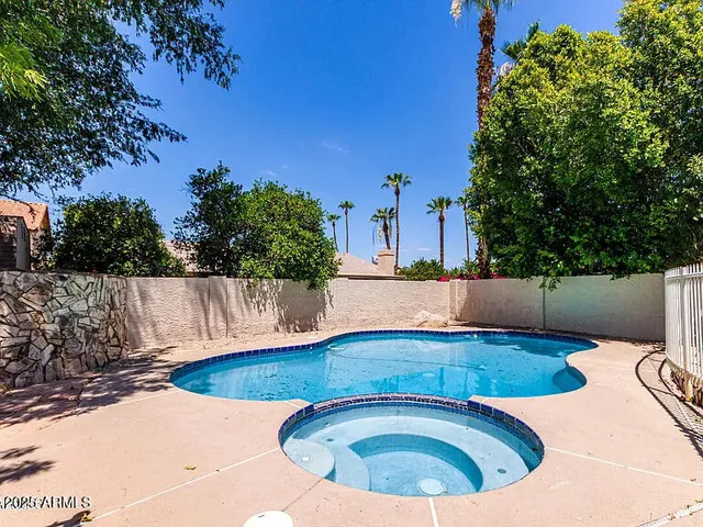 a view of a house with swimming pool