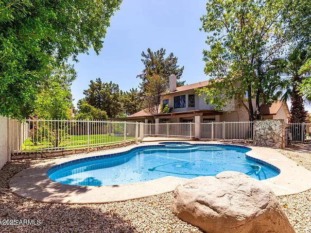 a view of a house with wooden floor and a yard