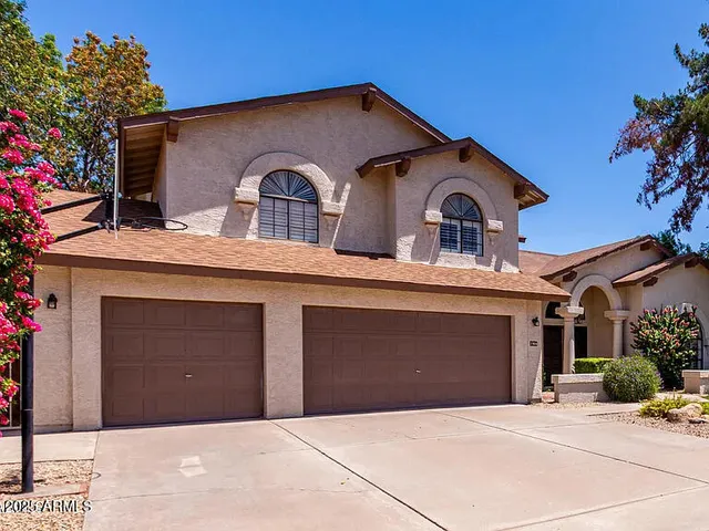 a front view of a house with garage