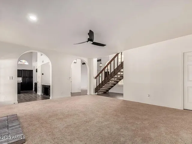 a view of a livingroom with a staircase