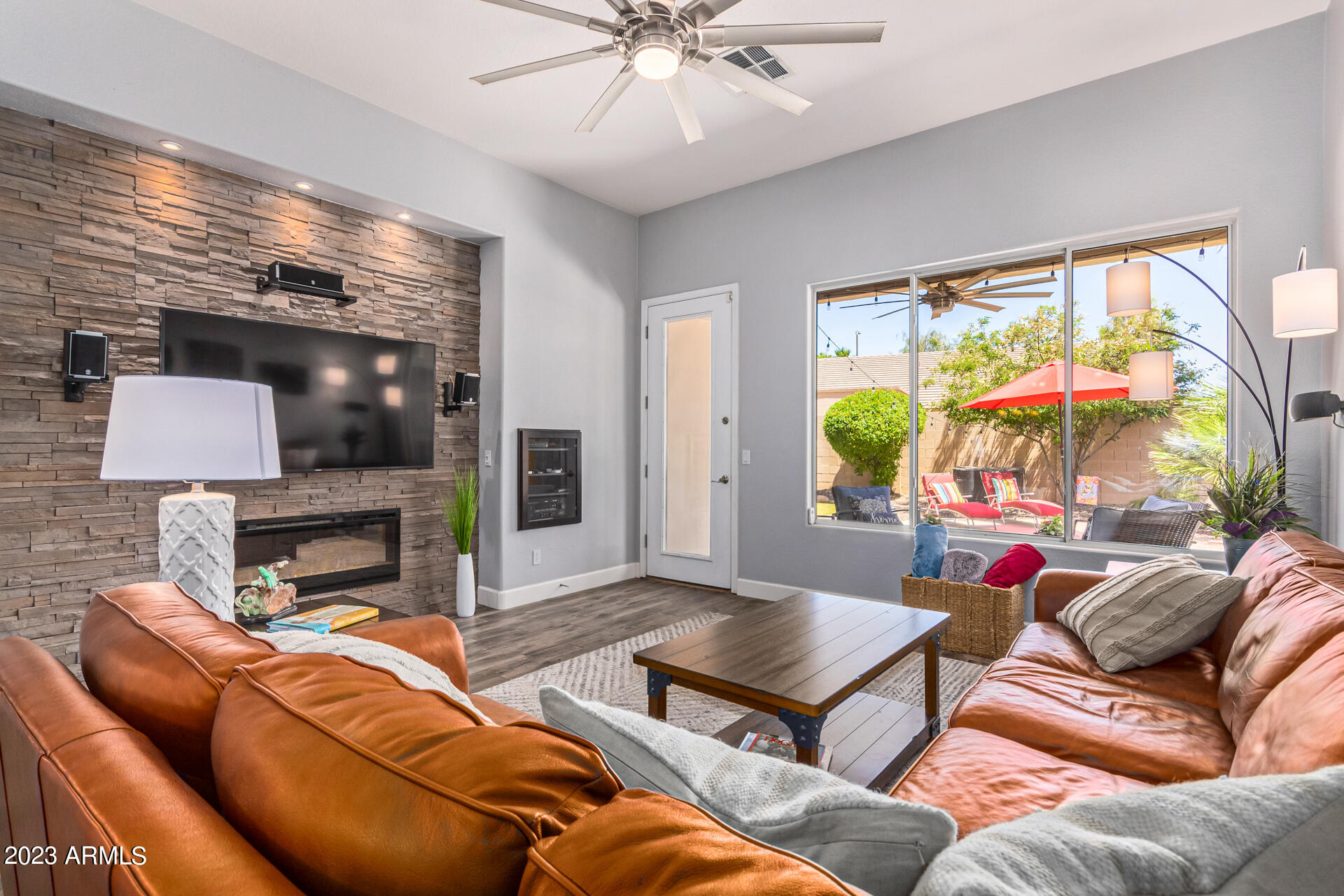 2065 South Marble Street Gilbert, AZ 85295 - Photo 18 of 59 a living room with furniture and a flat screen tv
