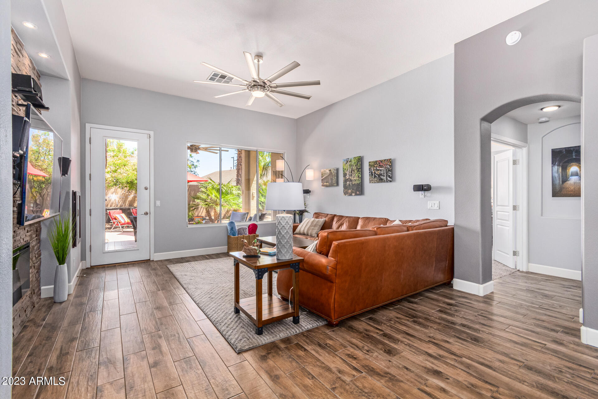 2065 South Marble Street Gilbert, AZ 85295 - Photo 19 of 59 a living room with furniture and a wooden floor