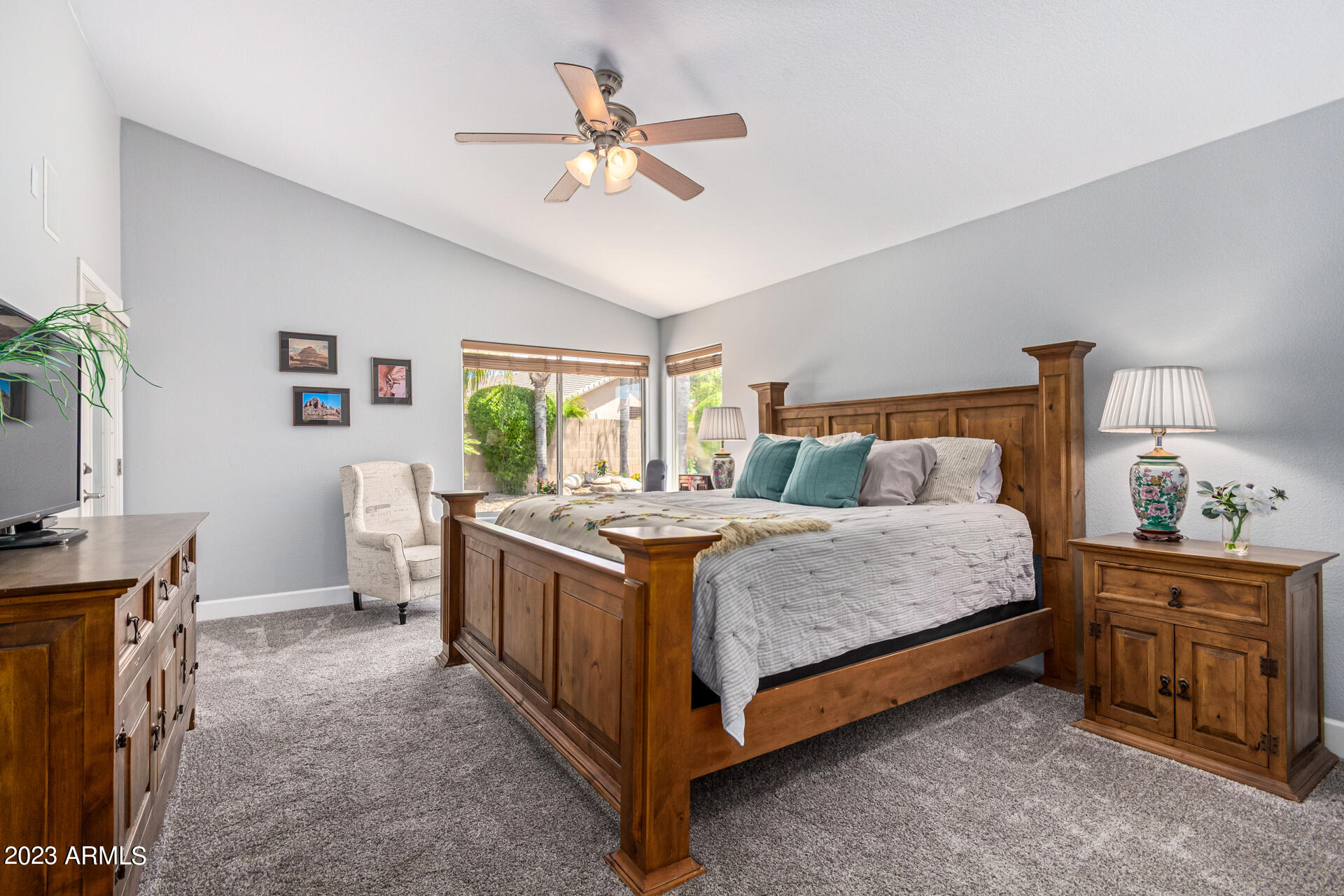2065 South Marble Street Gilbert, AZ 85295 - Photo 21 of 59 a bedroom with a bed and a chandelier