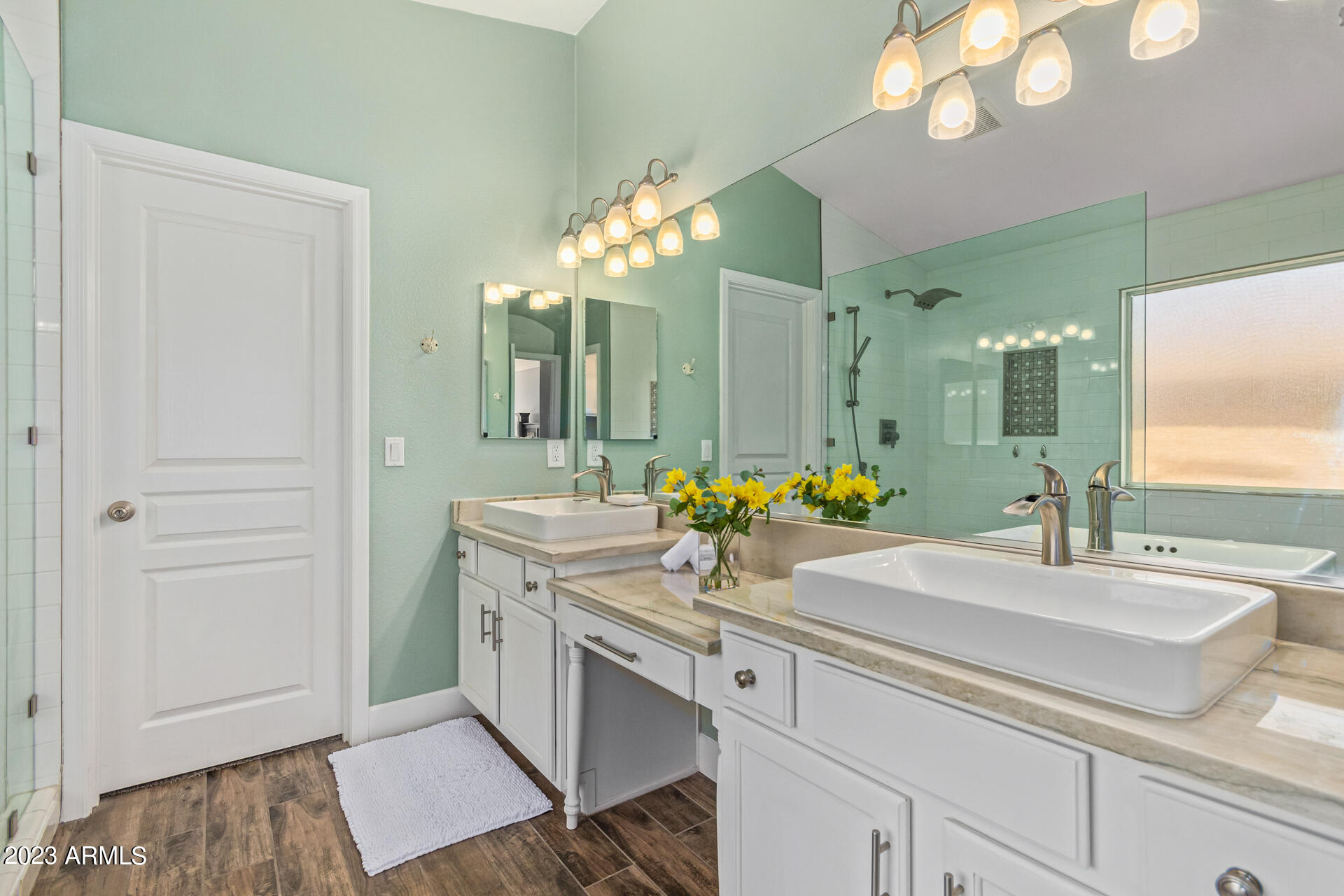 2065 South Marble Street Gilbert, AZ 85295 - Photo 24 of 59 a bathroom with a sink and a mirror