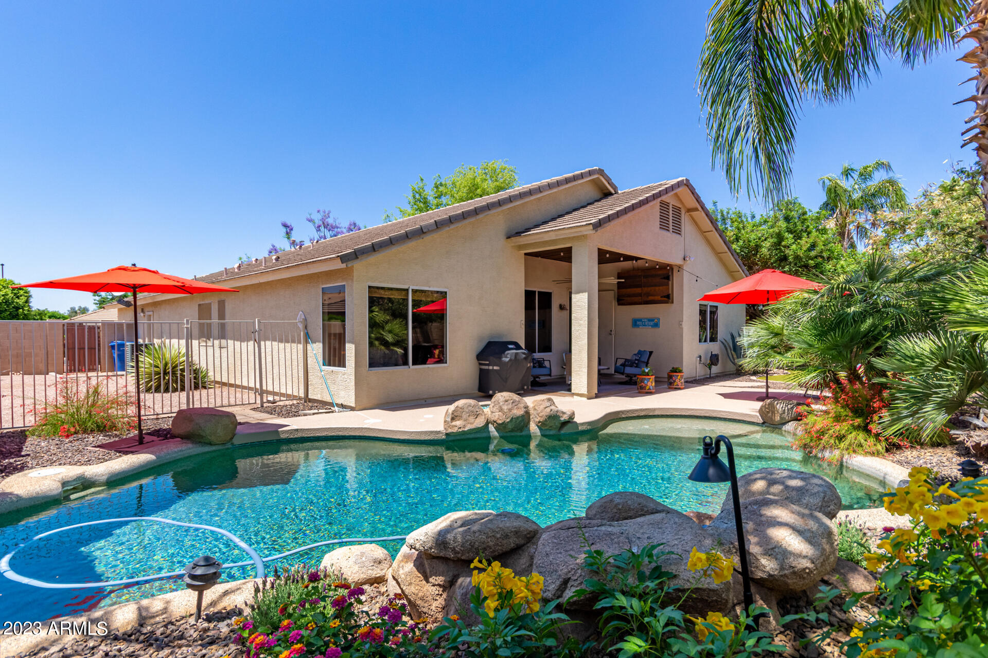 2065 South Marble Street Gilbert, AZ 85295 - Photo 33 of 59 a view of a house with swimming pool and furniture