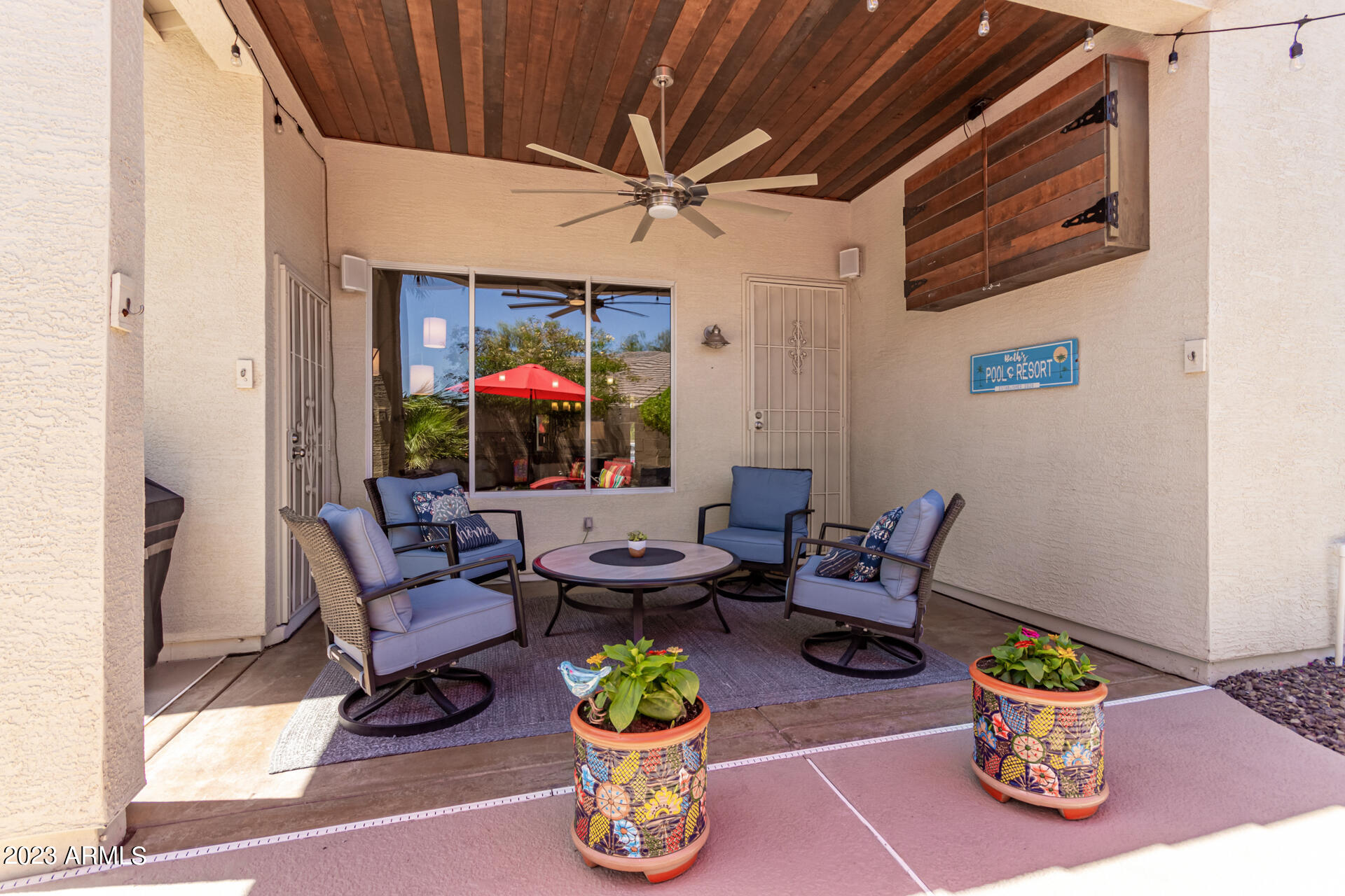2065 South Marble Street Gilbert, AZ 85295 - Photo 40 of 59 a living room with furniture a fireplace and a table