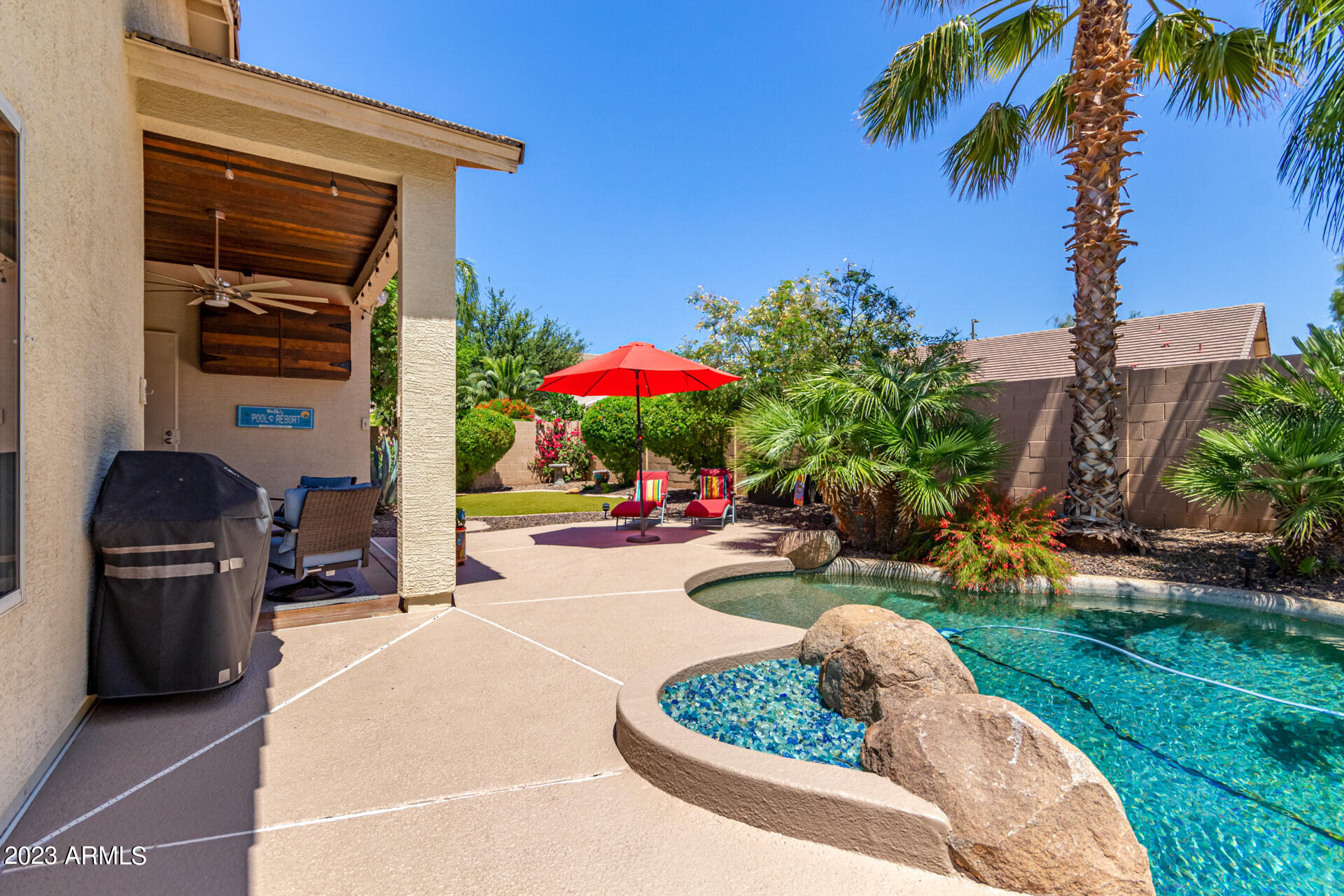 2065 South Marble Street Gilbert, AZ 85295 - Photo 41 of 59 a view of a backyard with a patio and fire pit