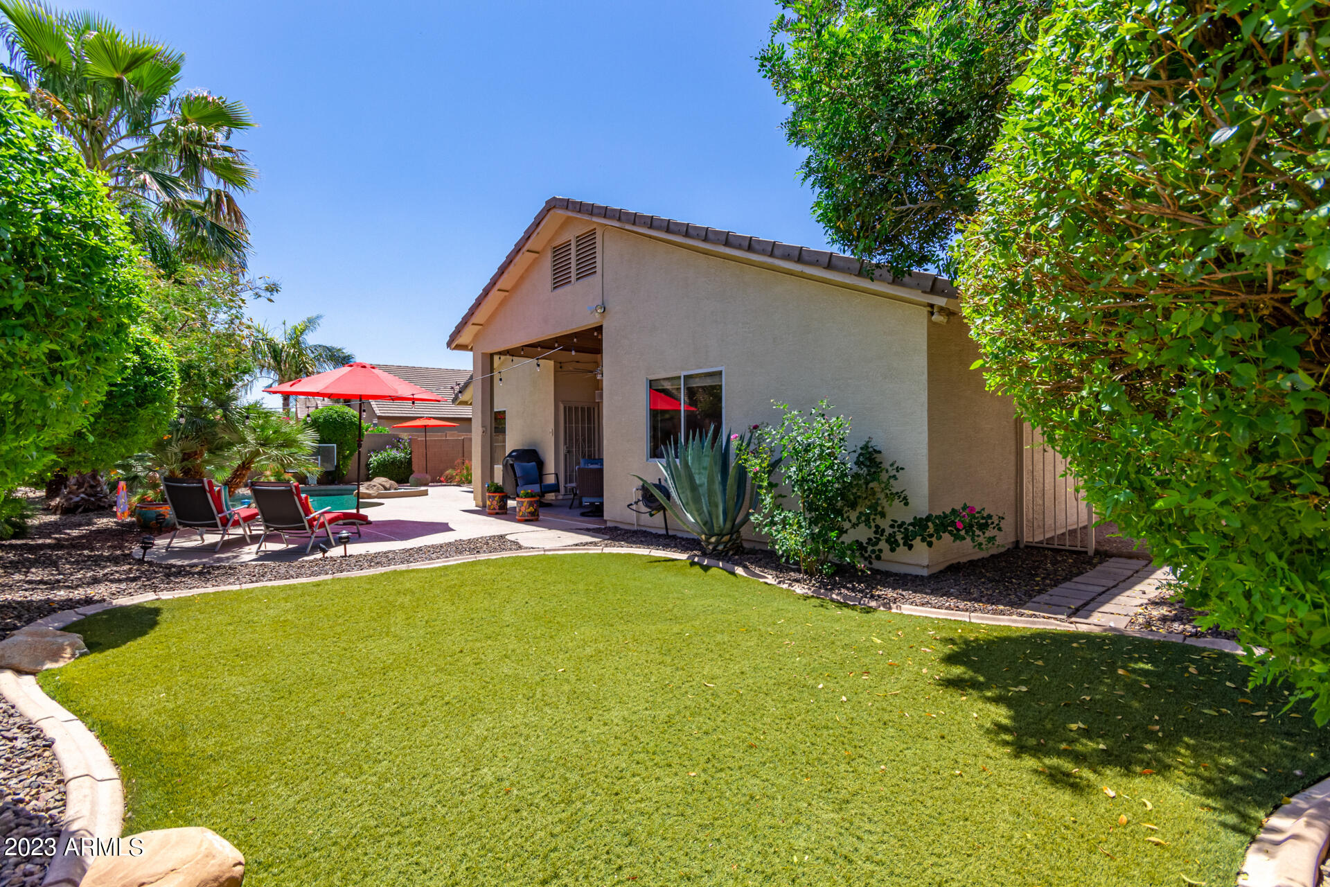 2065 South Marble Street Gilbert, AZ 85295 - Photo 43 of 59 a view of a house with swimming pool and sitting area