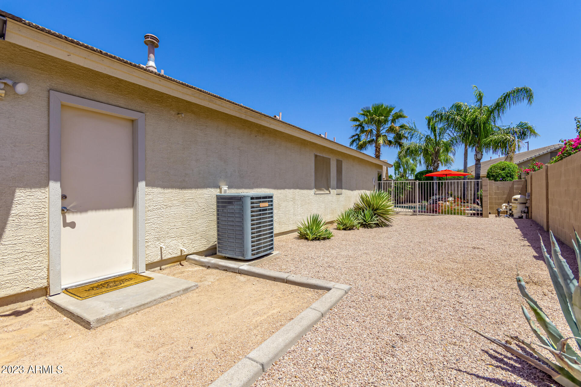 2065 South Marble Street Gilbert, AZ 85295 - Photo 44 of 59 a house with palm trees in front of it