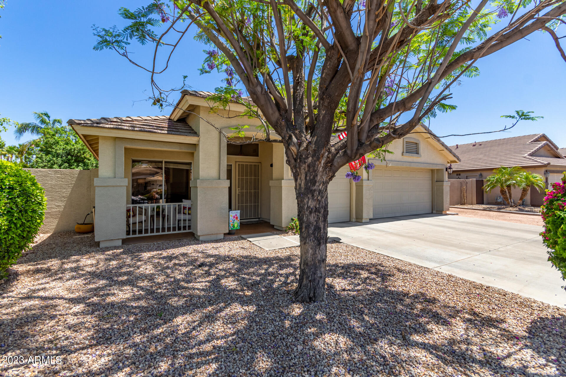 2065 South Marble Street Gilbert, AZ 85295 - Photo 49 of 59 a front view of a house with a tree