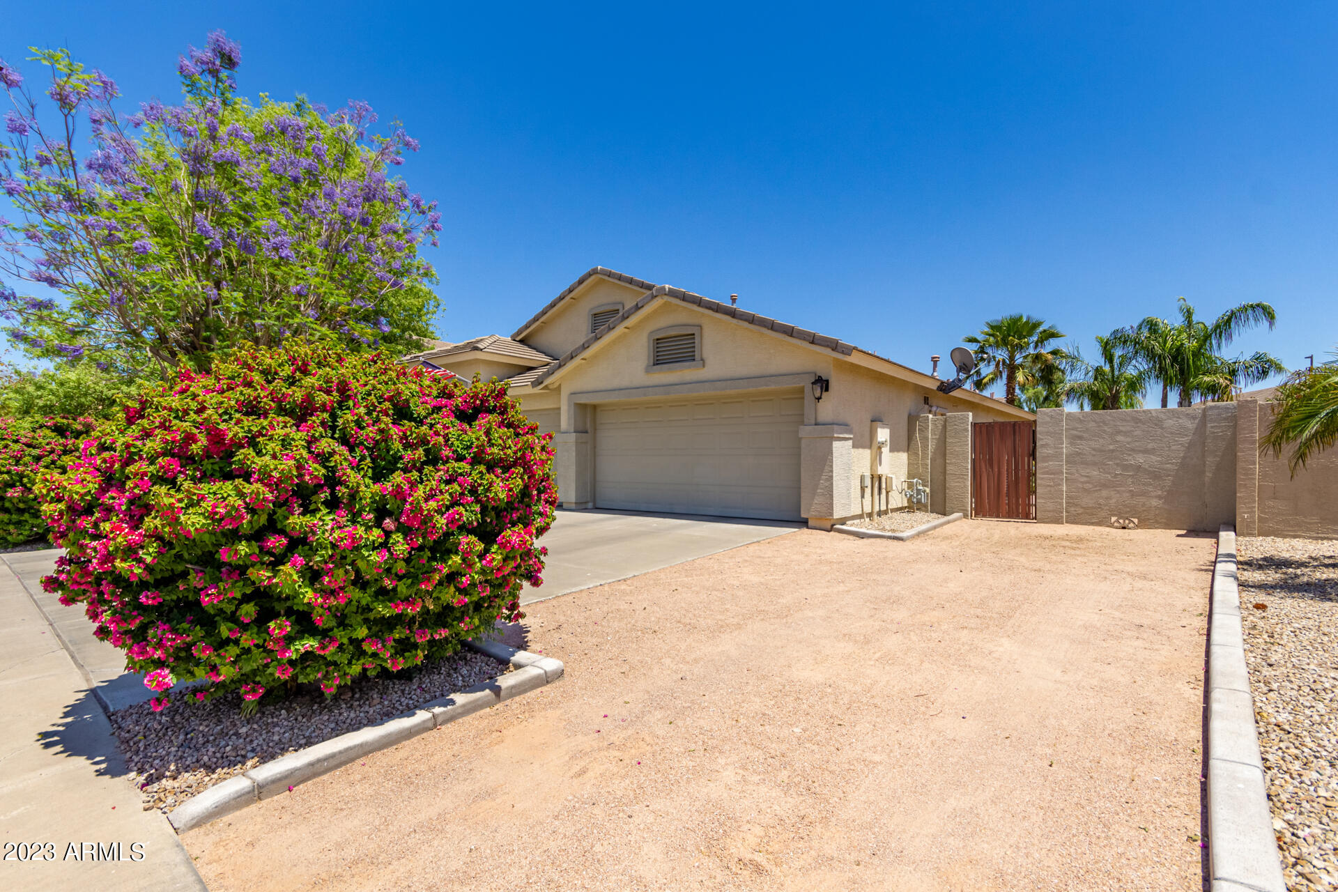 2065 South Marble Street Gilbert, AZ 85295 - Photo 5 of 59 a front view of a house with a yard