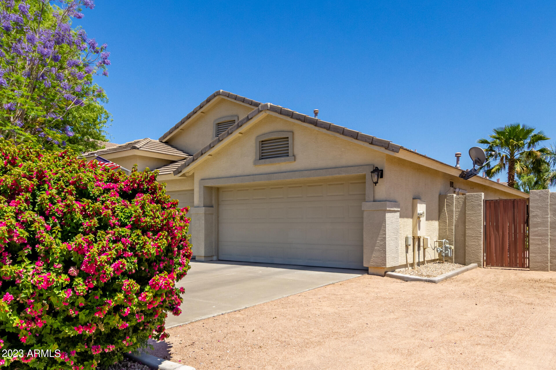 2065 South Marble Street Gilbert, AZ 85295 - Photo 51 of 59 a front view of a house with a yard