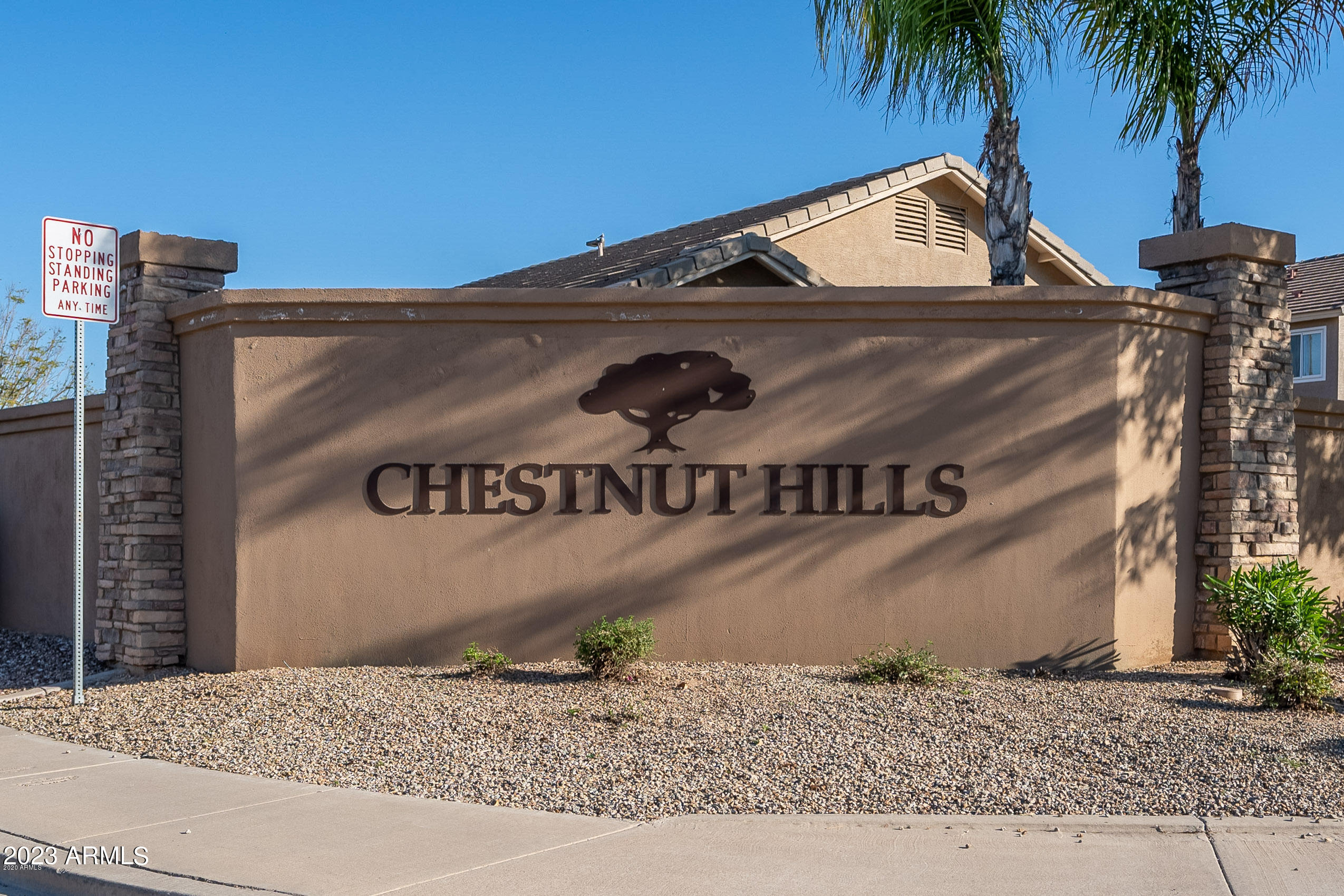 2065 South Marble Street Gilbert, AZ 85295 - Photo 55 of 59 a front view of a house with sign board