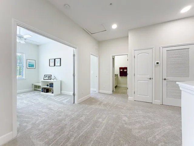 a view of a livingroom with a kitchen
